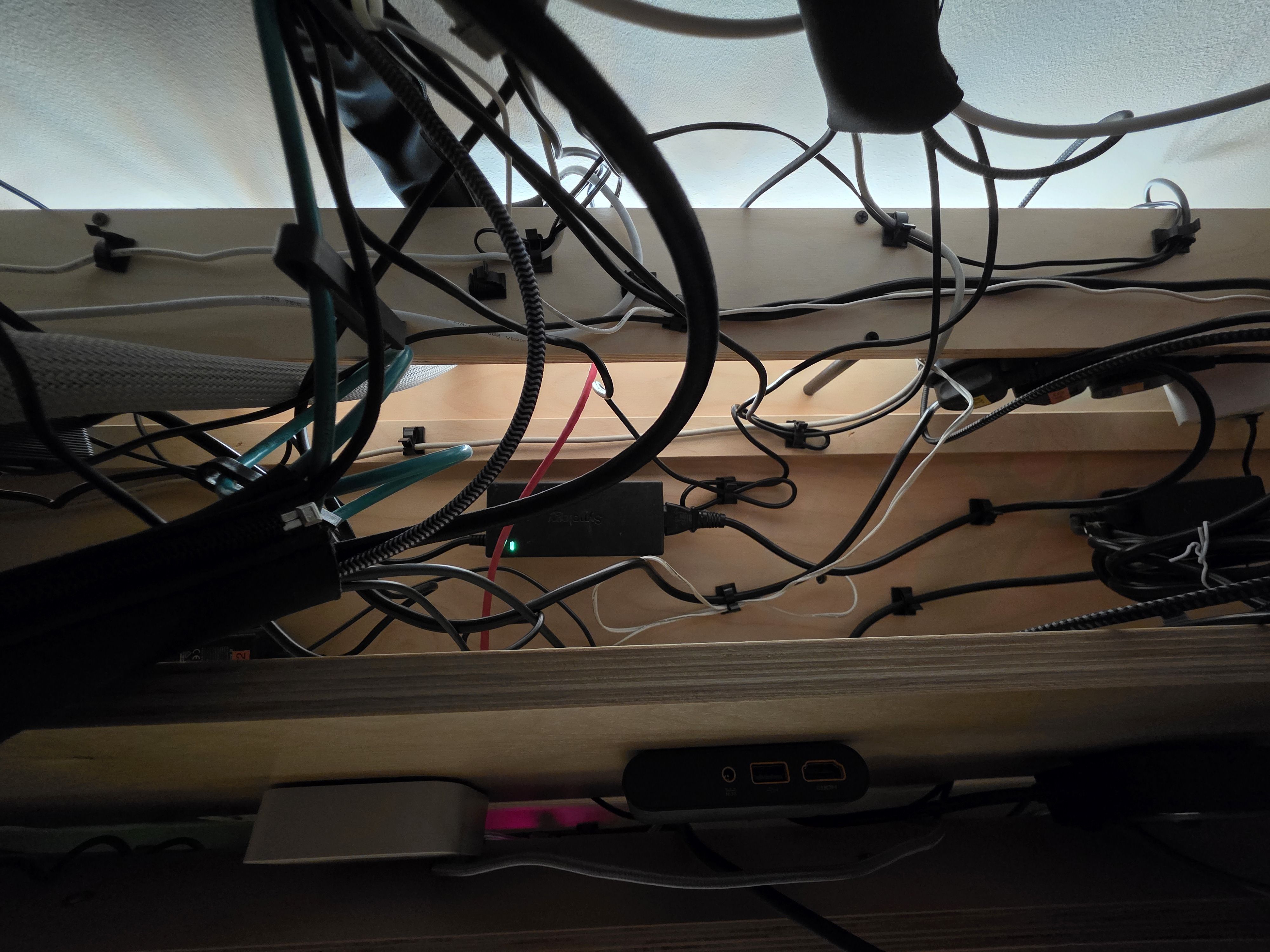 the underside of Daniel McIlvaney’s desk