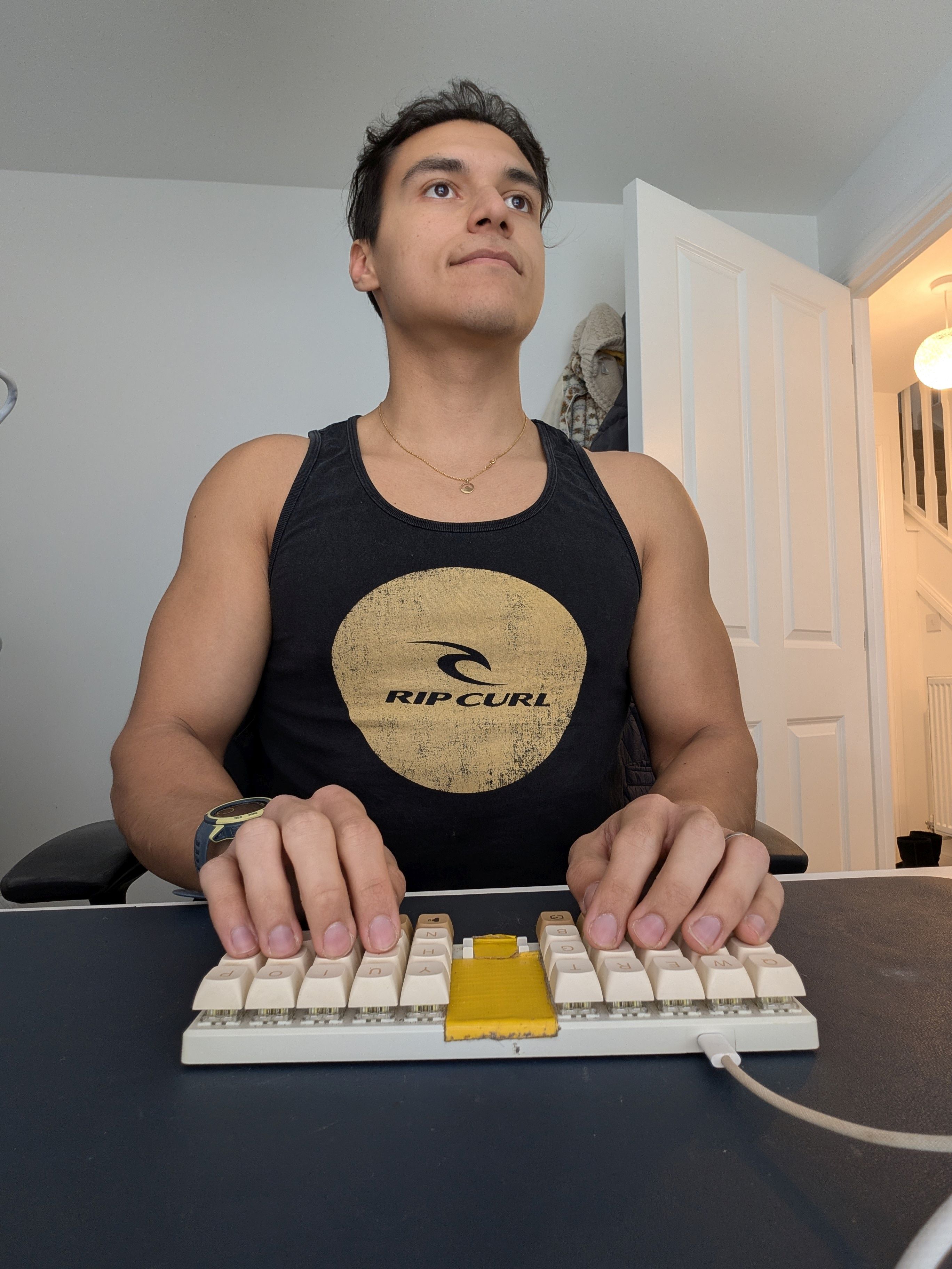 Matthew Castrillon-Madrigal looking a little happier, with his modded Planck keyboard