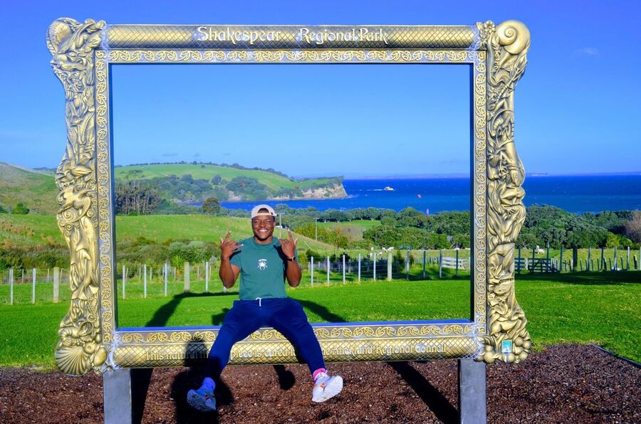 Pelumi Fafowora sitting in a picture frame