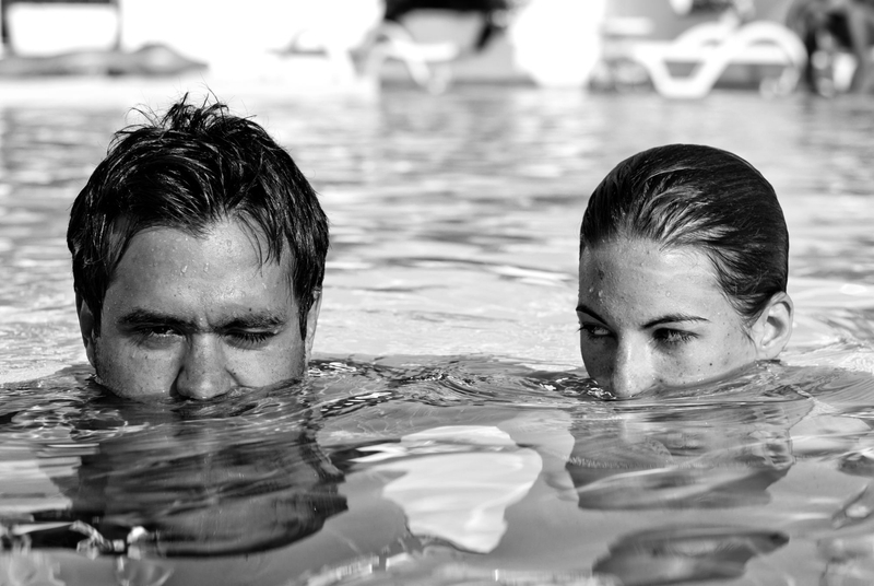Ahmet Necati Uzer's black-and-white photo of two people up to heir noses in a swimming pool