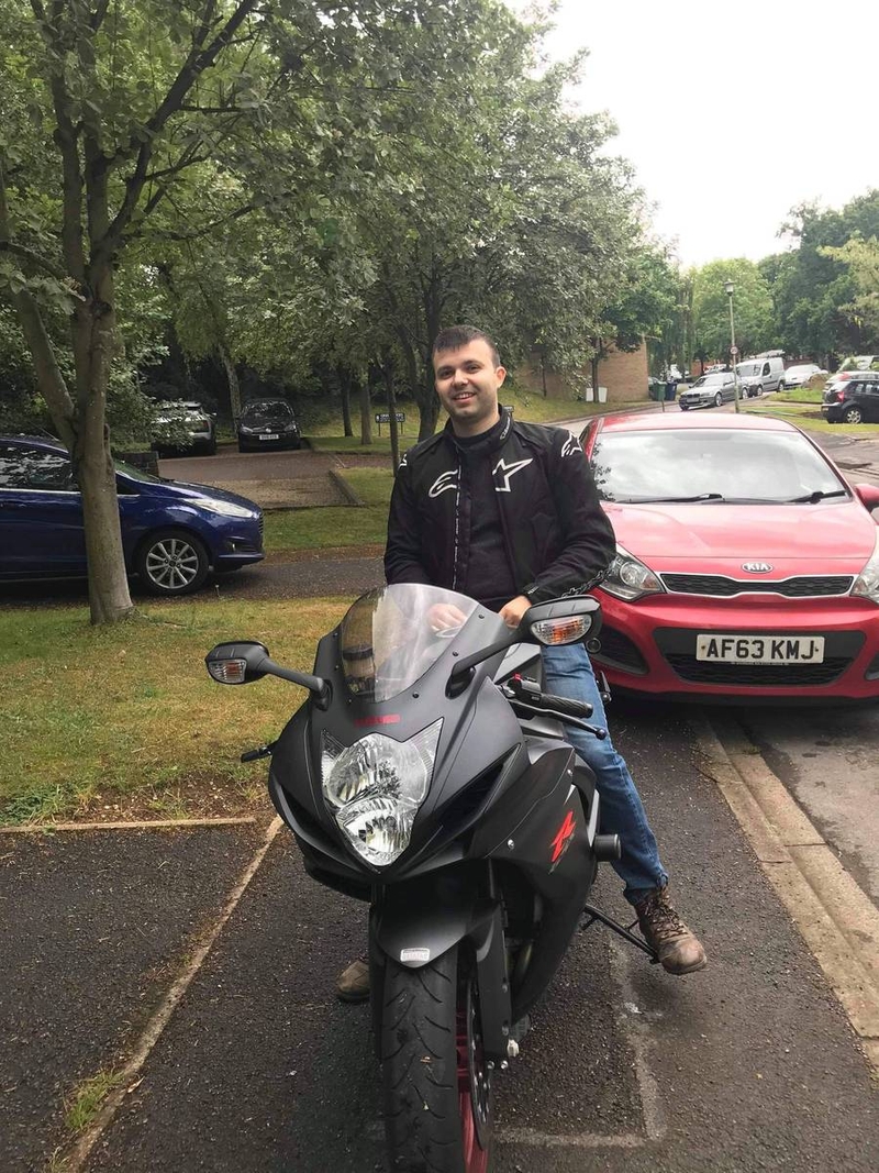 Alin Cota on a motorcycle