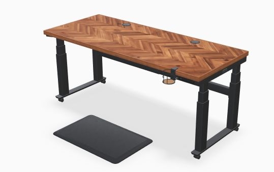 Cynthia Zujko's desk, which is made of wood set in a chevron pattern