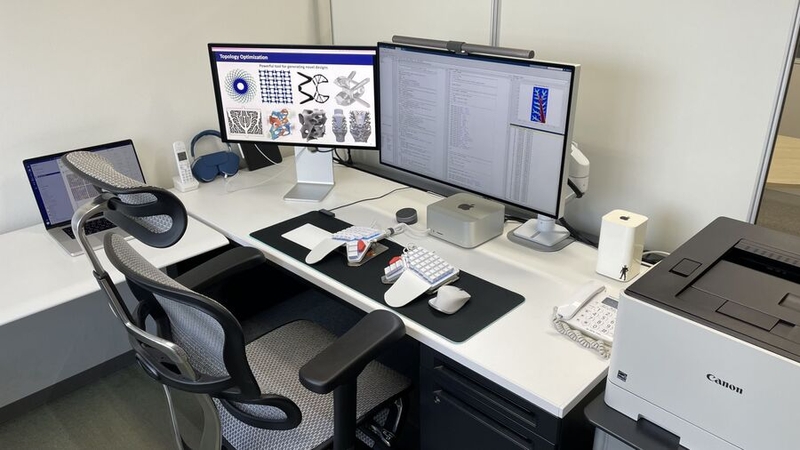 Dr. Yaji's office workspace includes two OKAMURA desks and an Ergohuman PRO2 Ottoman chair Kentaro Yaji's setup