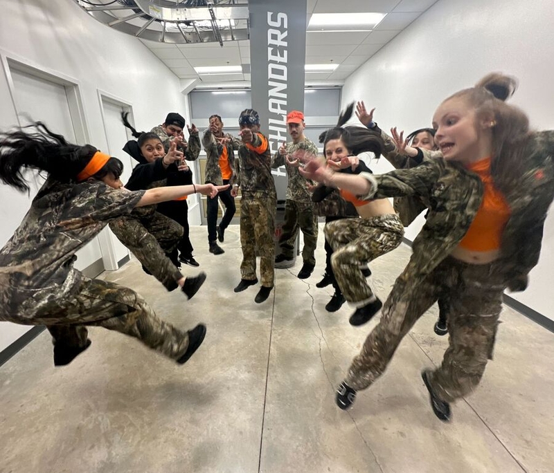 Angie Chiraz dances with a group