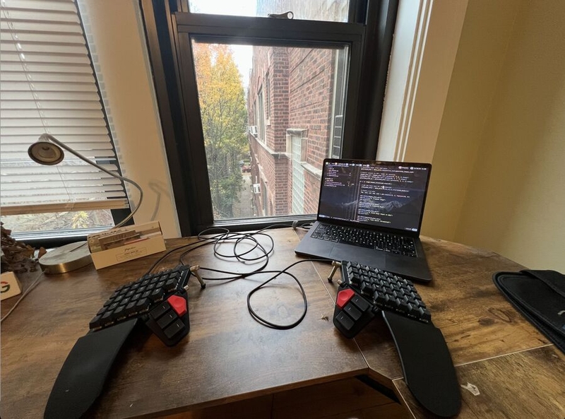 Nico Posner's setup with a nice window view of a brick building